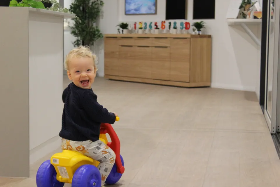 Child enjoying weekend childcare activities on a bike